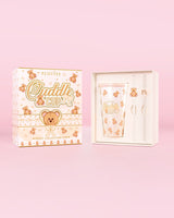 Imagen del vaso y pajita de acero con forma de osito de peluche de P.Louise en un empaque con un diseño con estampado de osito