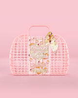 Cesta rosa estilo waffle com um produto dentro em um fundo rosa