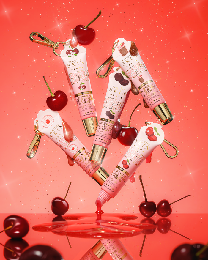 Rosa glitter cereja perfumada protege seus tubos de condicionador labial com desenho de cereja em um fundo vermelho