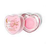 Máscara para dormir con labios en forma de corazón rosa con la tapa abierta sobre un fondo blanco