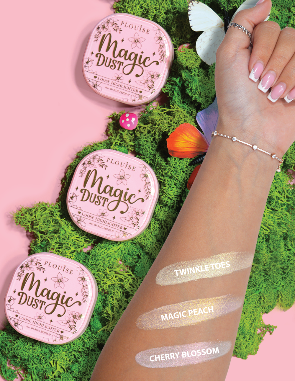 Três marcadores compactos e soltos rotulados Magic Dust nos tons Twinkle Toes, Magic Peach e Cherry Blossom, exibidos em um braço com fundo floral.