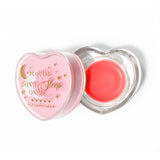 Máscara para dormir con labios en forma de corazón rosa con la tapa abierta sobre un fondo blanco