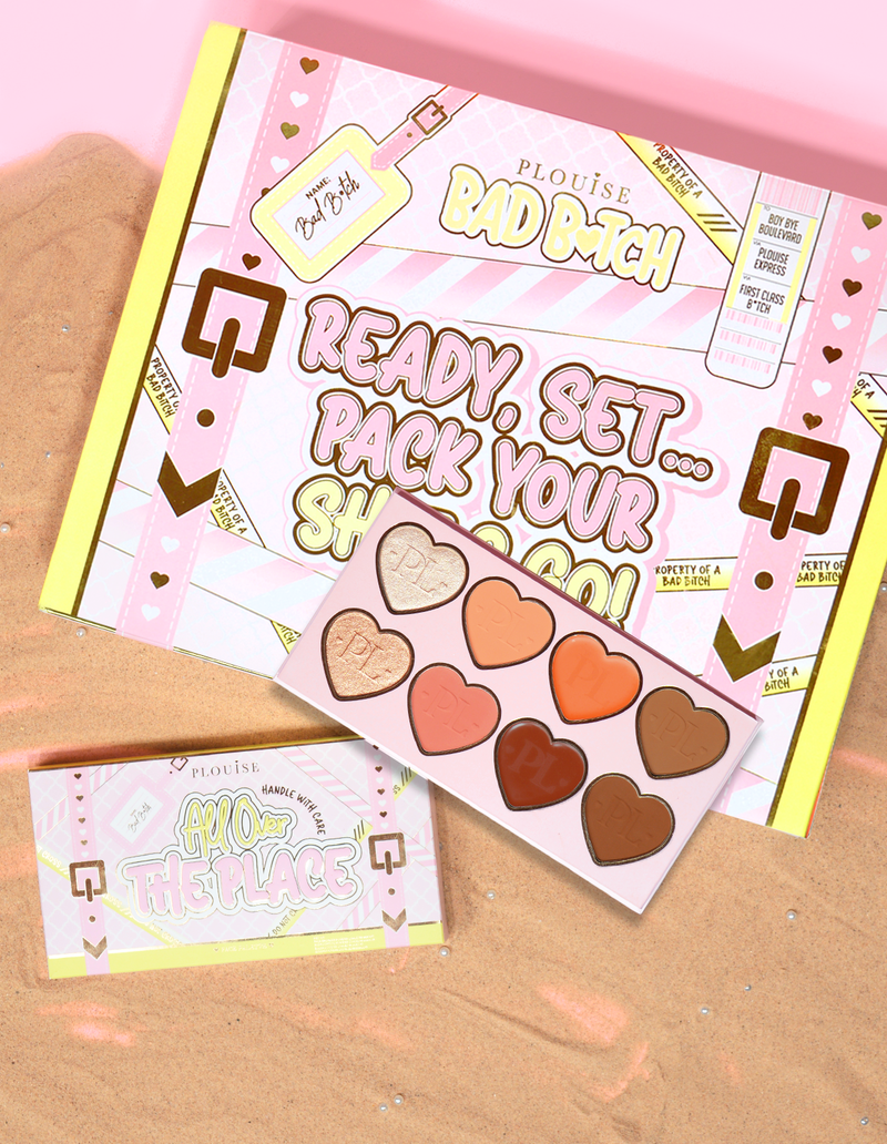 P.Louise All Over The Place Face Palette embalagem e produto exibido com tons de pan em formato de coração em várias cores sobre um leito de areia.