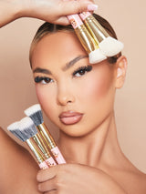 An image of a woman model wearing makeup holding the P.Louise Spoilt For Choice 5-Piece Makeup Brush Set against her face